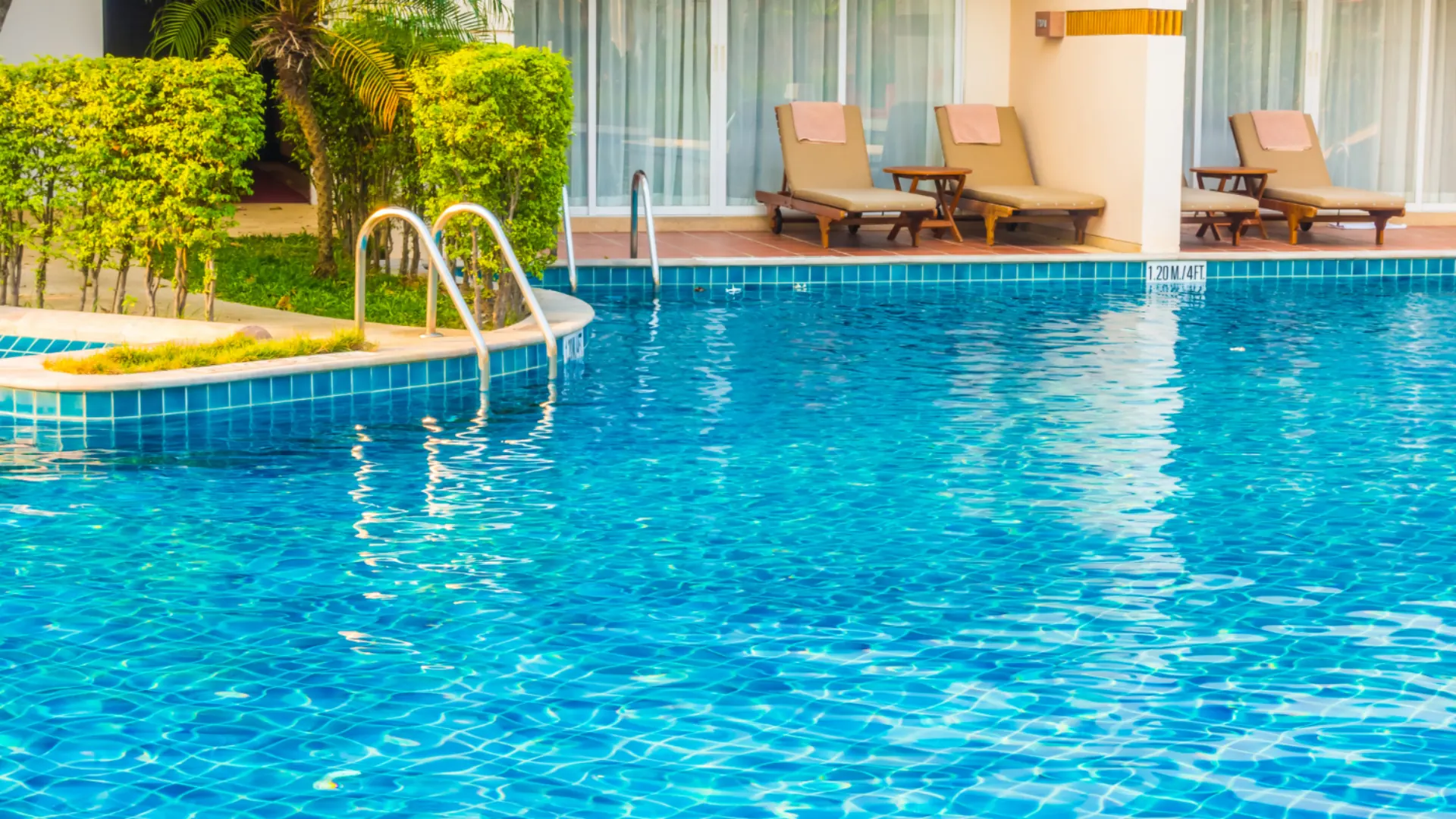 Pool with sun loungers